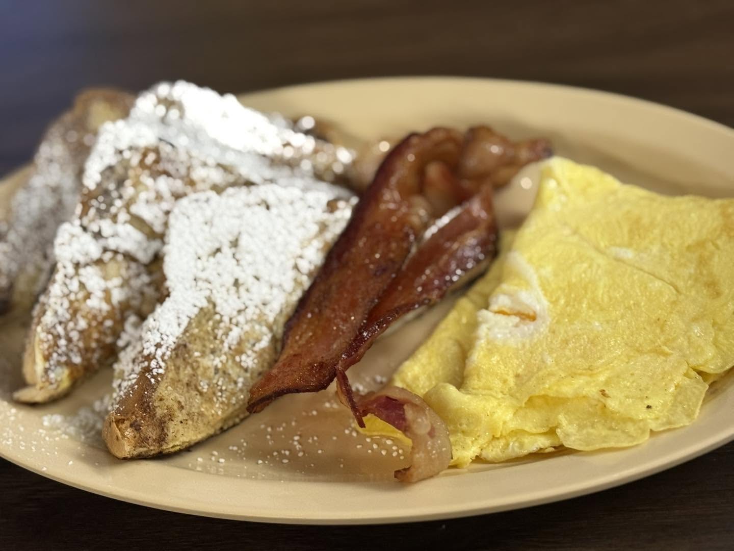 French toast, bacon and omelet breakfast plate