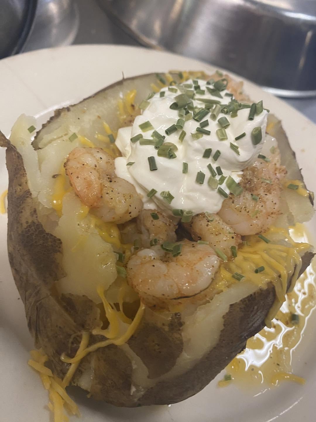 Shrimp-stuffed loaded baked potato